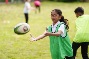 girl-playing-rugby